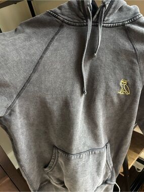 OVO grey Hoodie with Gold Owl Logo
In excellent condition, gently worn